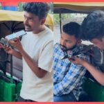 Boy bargains with auto driver